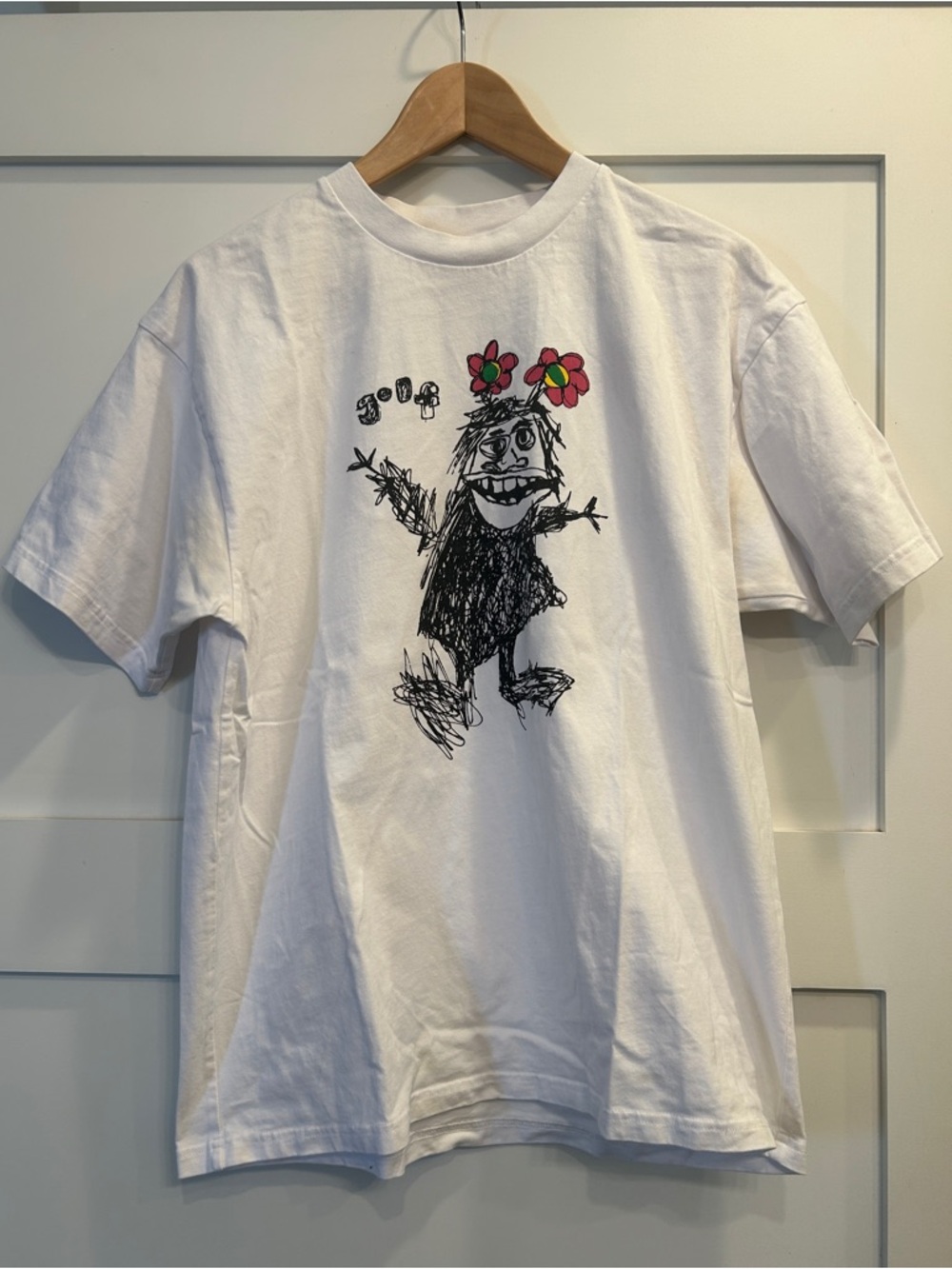 White Graphic Golf T-Shirt with Flower Character